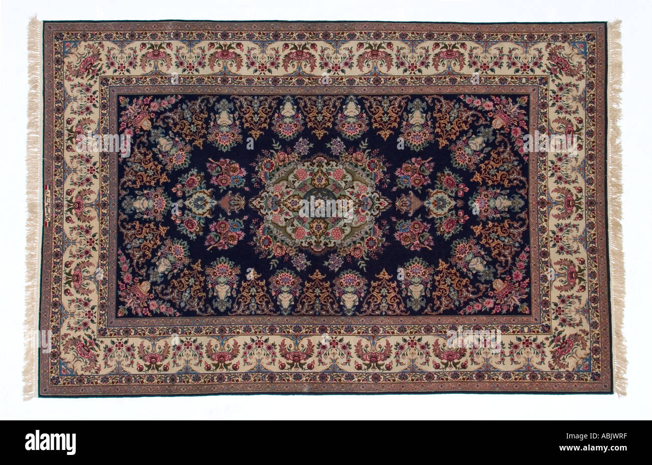 Persian handmade silk carpet showing intricate weaving and knotting