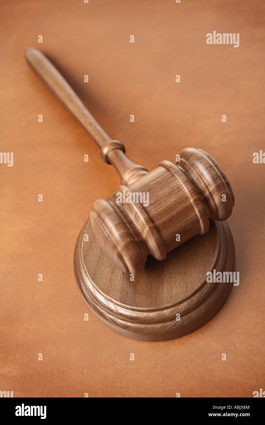 Gavel on brown leather surface Stock Photo