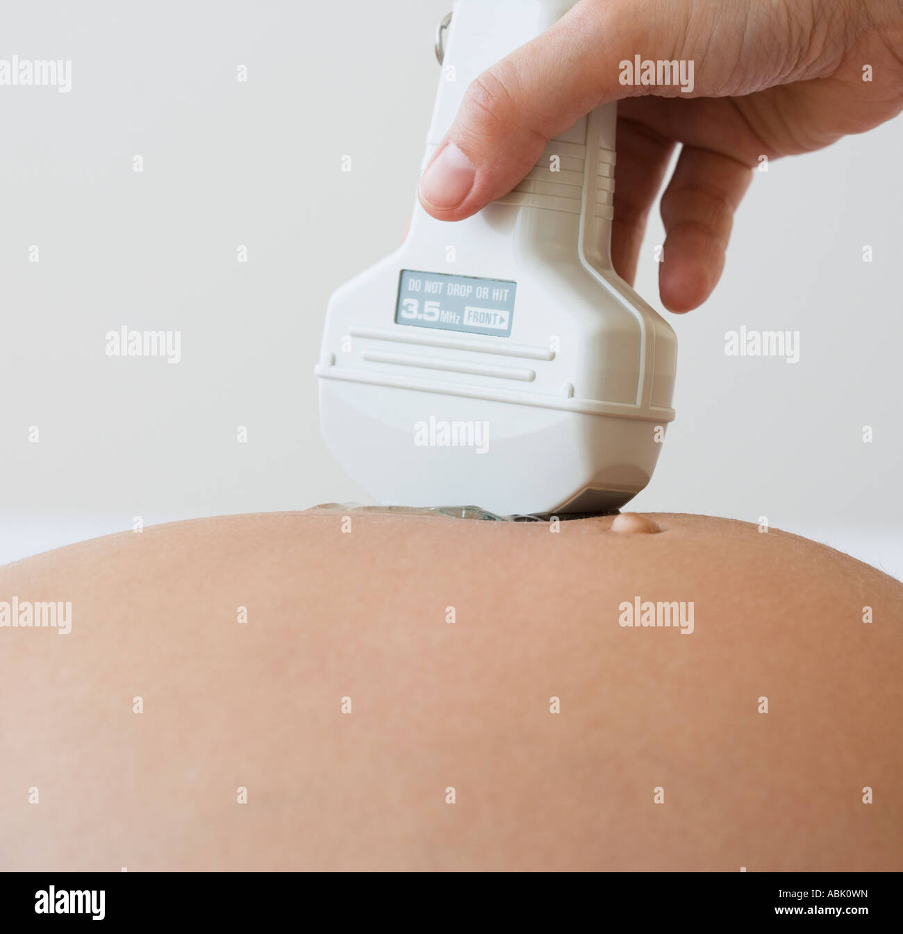 Ultrasound wand on pregnant woman Stock Photo Alamy