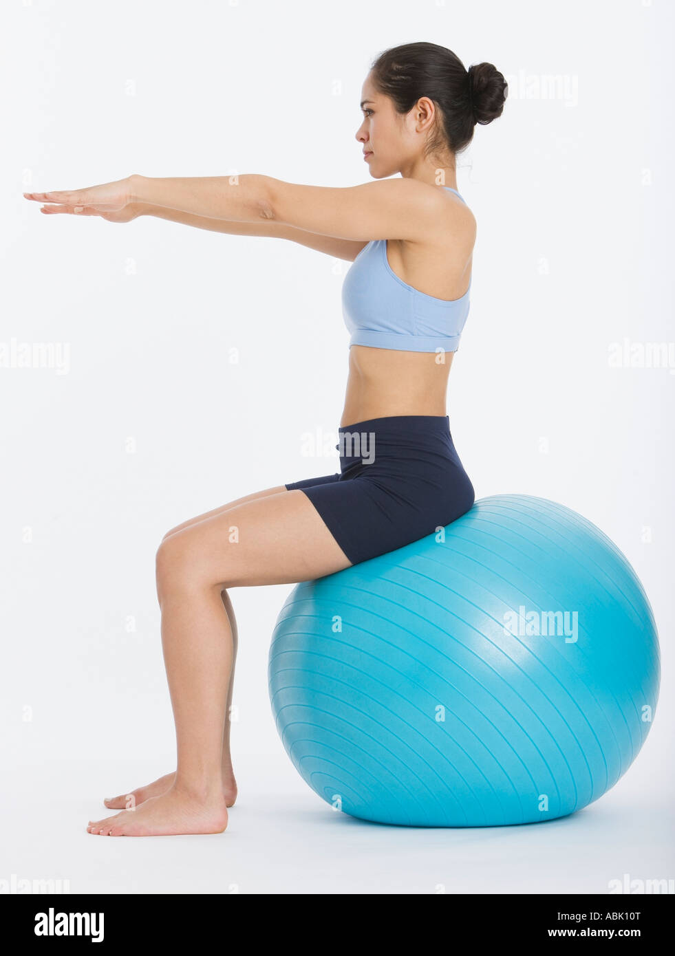 Woman sitting on exercise ball Stock Photo - Alamy