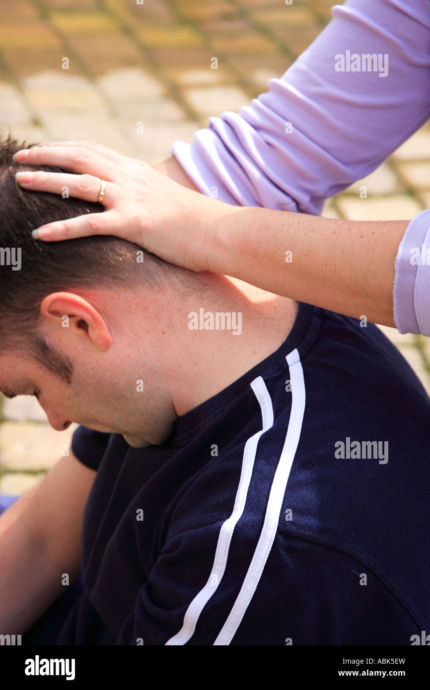 Stretching the neck as part of a Thai body massage Stock Photo Alamy