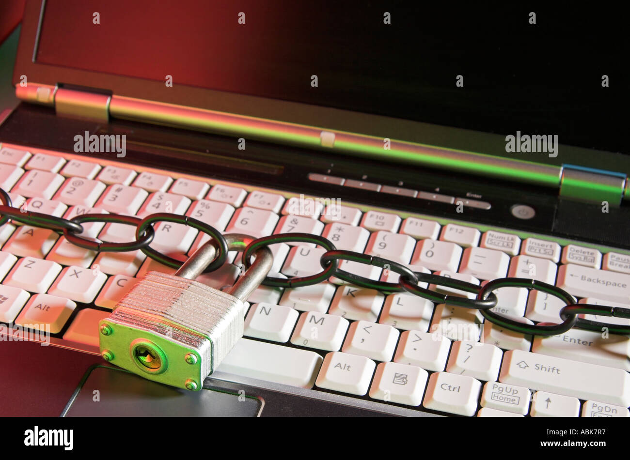 Computer security concept, locked up laptop keyboard, all logos removed