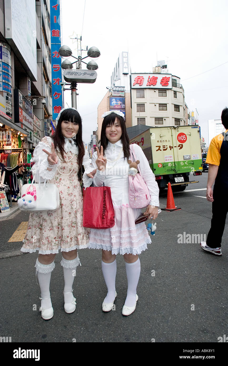 Japanese girls pose in the Harajuku district of Tokyo in Japan. Stock Photo