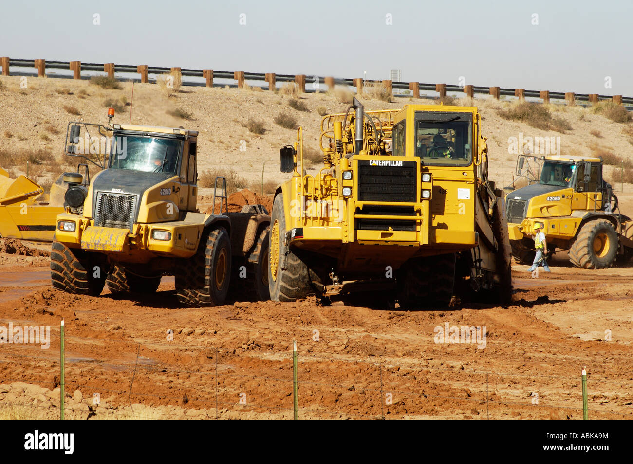 earthmoving equipment at work preparing a construction site for