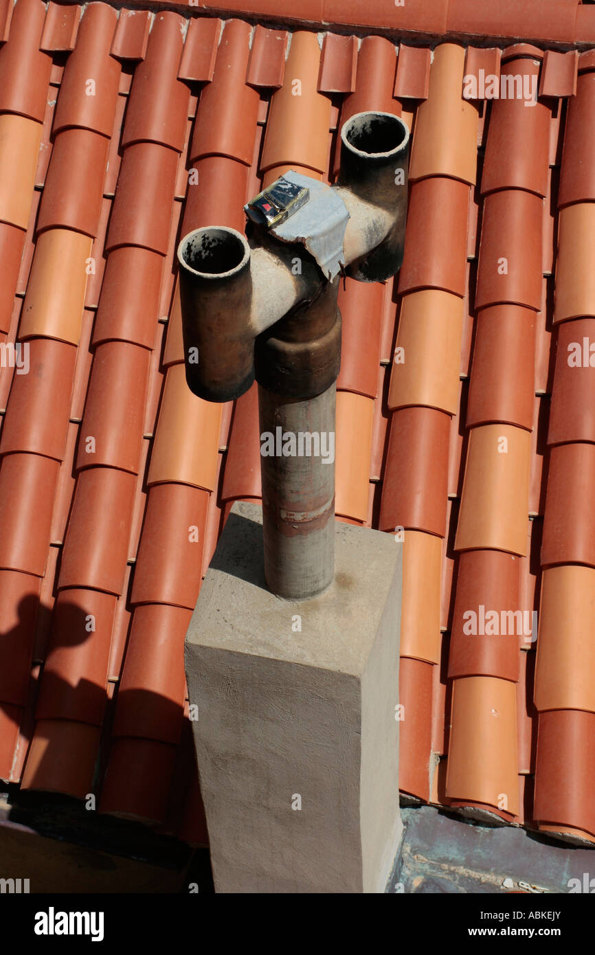 Terracotta roof with chimney in Drovnic, Croatia Stock Photo