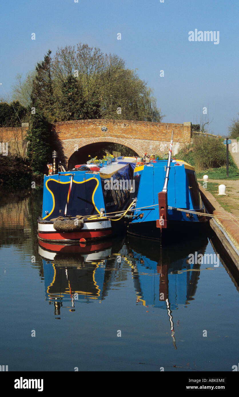 Colourfull narrow boats moored on the Basingstoke Canal at Odiham Quay