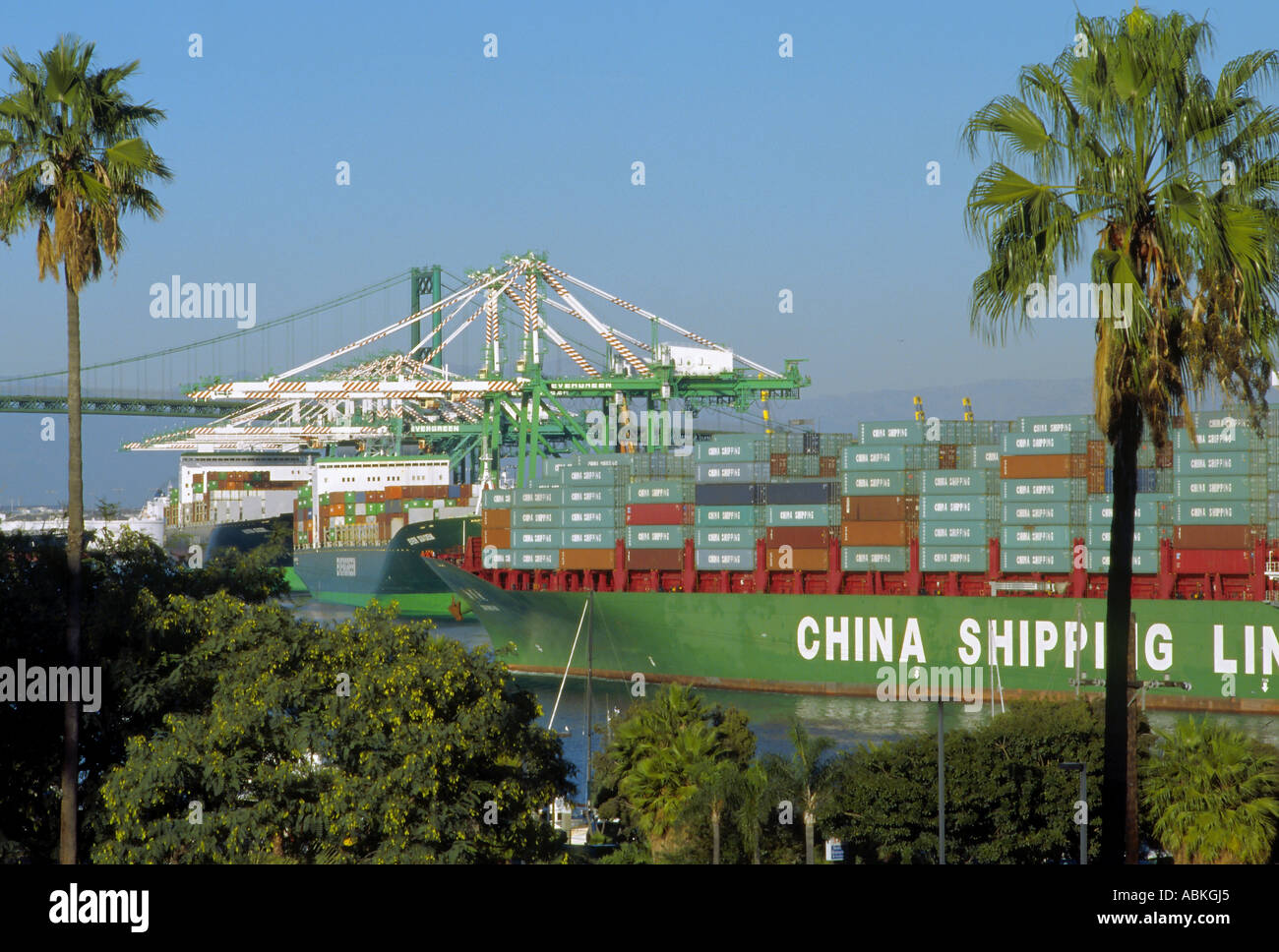 China Shipping container ship slowly maneuvering through the main channel in San Pedro harbor, California Stock Photo
