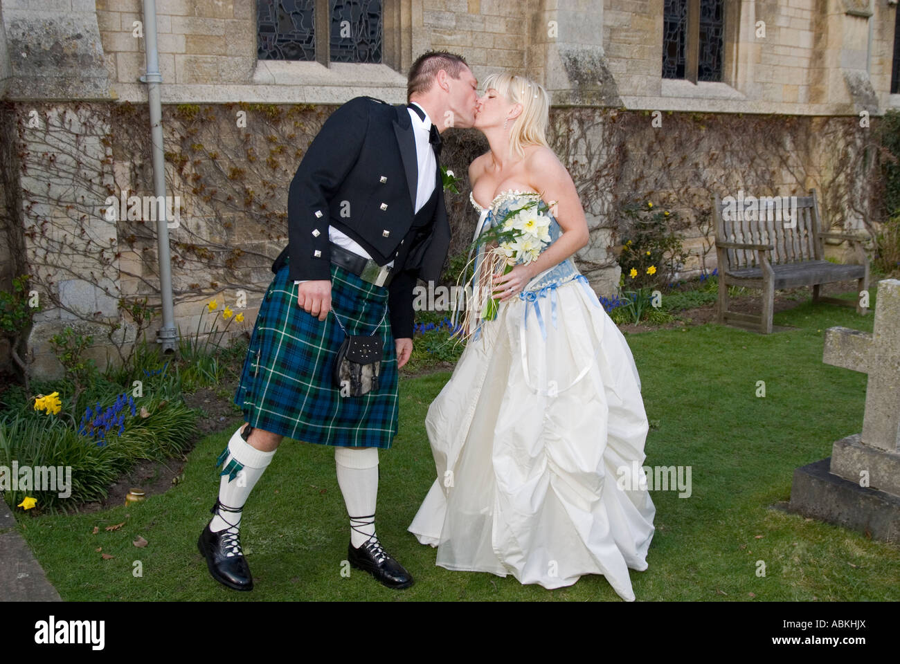 Bride and Groom kissing outside Church after their wedding Stock Photo ...