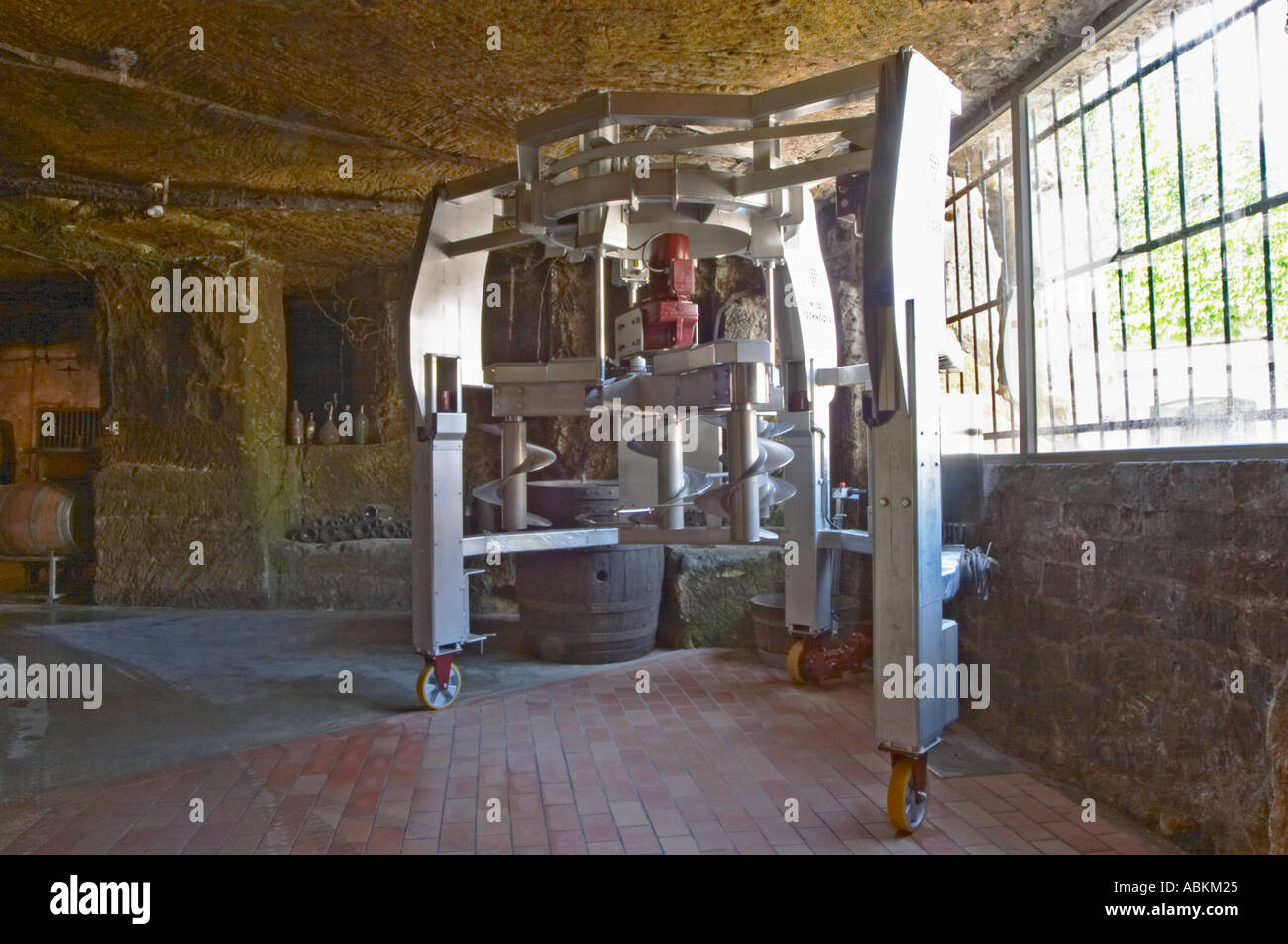 The underground winery and cellar in an old stone quarry, a curious machine with screws for
