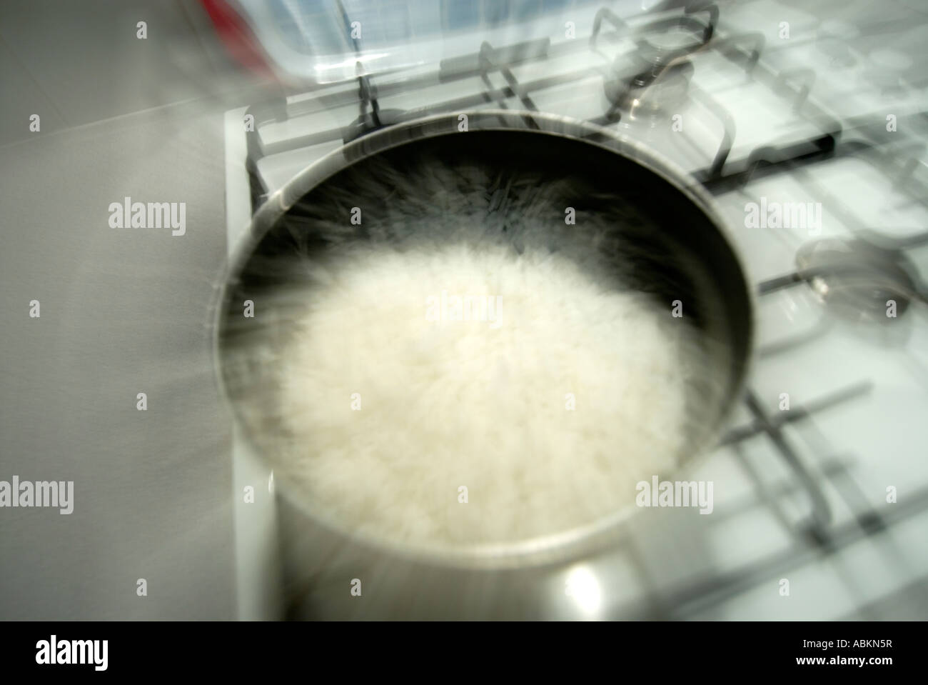 boiling rice on a cooker in the kitchen Stock Photo Alamy