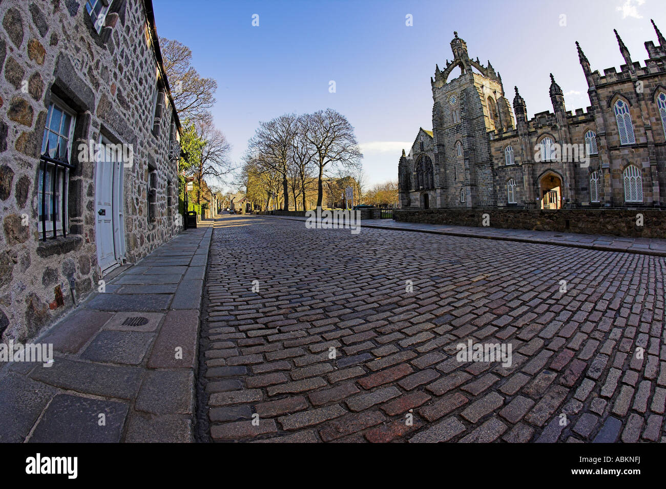 Kings College in Aberdeenwith cobbled road with blue skies. Stock Photo