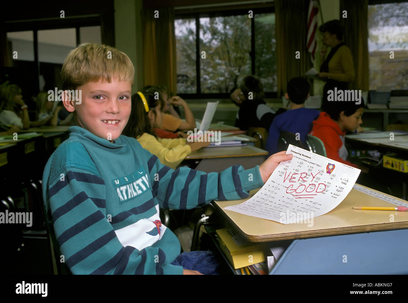 3rd grade child perform very good on an assignment and is rewarded Stock Photo