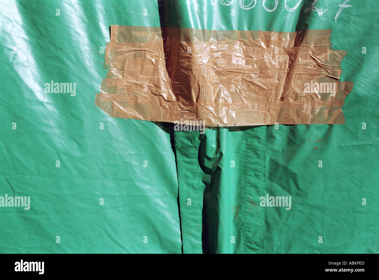 brown gaffer tape repair on green canopy Stock Photo Alamy