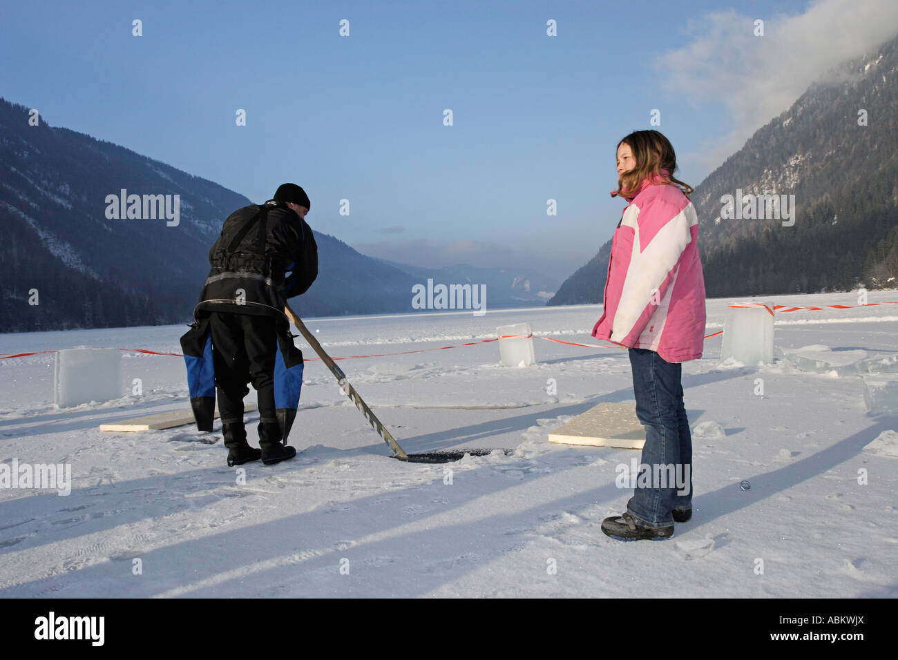 scuba diver cutting hole in the ice Stock Photo Alamy