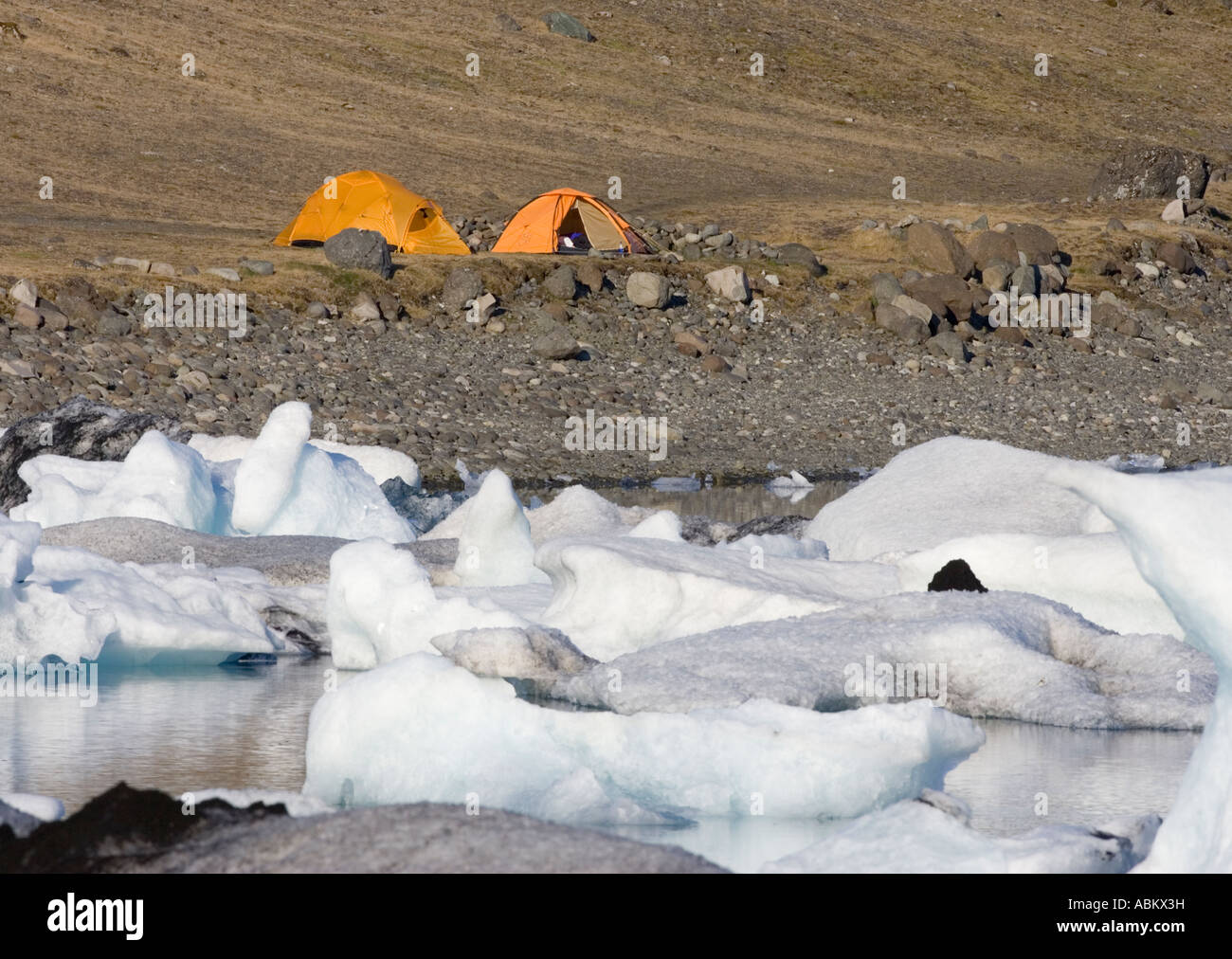 Campers in Orange Tents Stock Photo