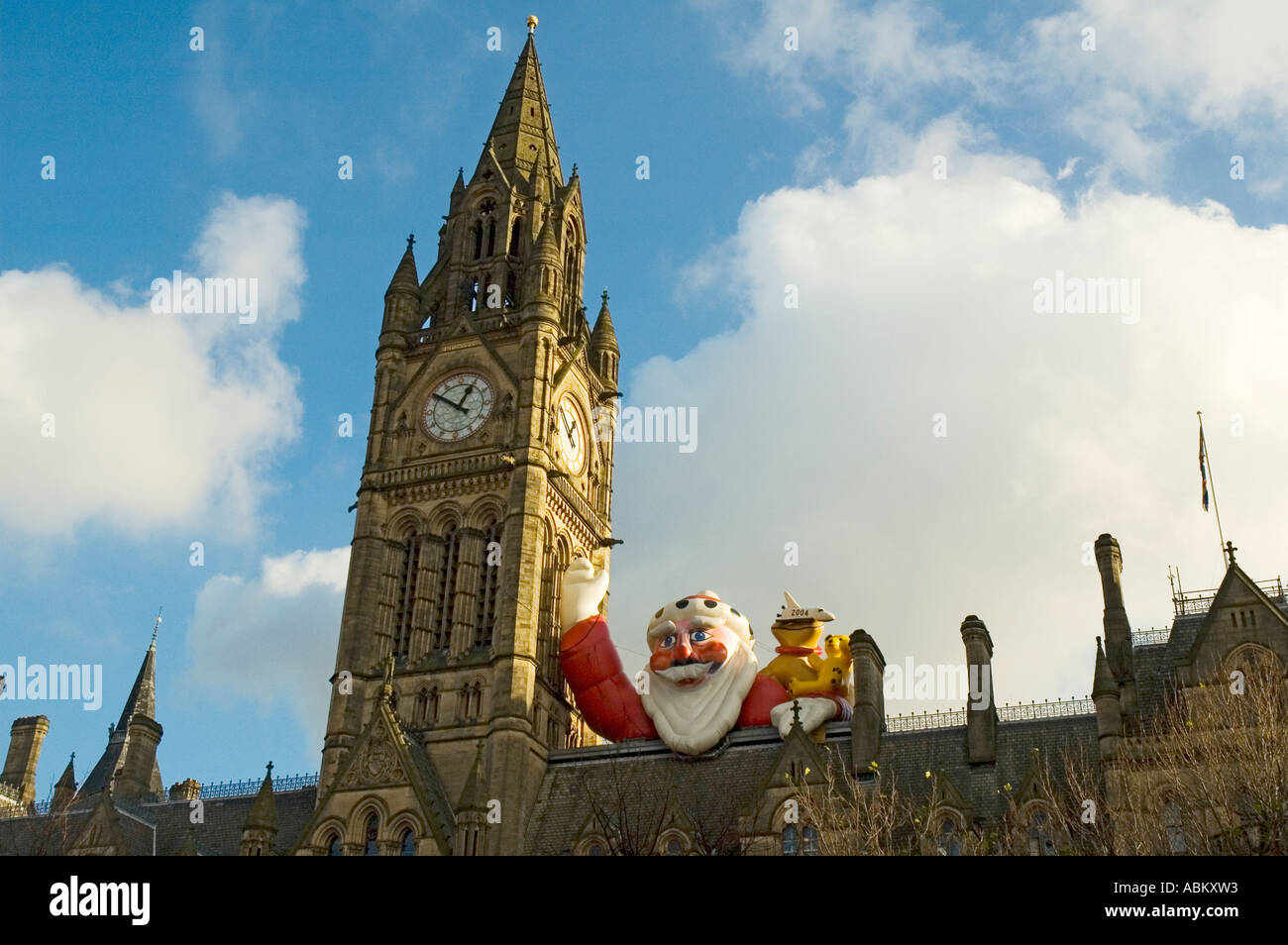 Inflatable Father Christmas on the roof of the Town Hall, Manchester, England, UK Stock Photo