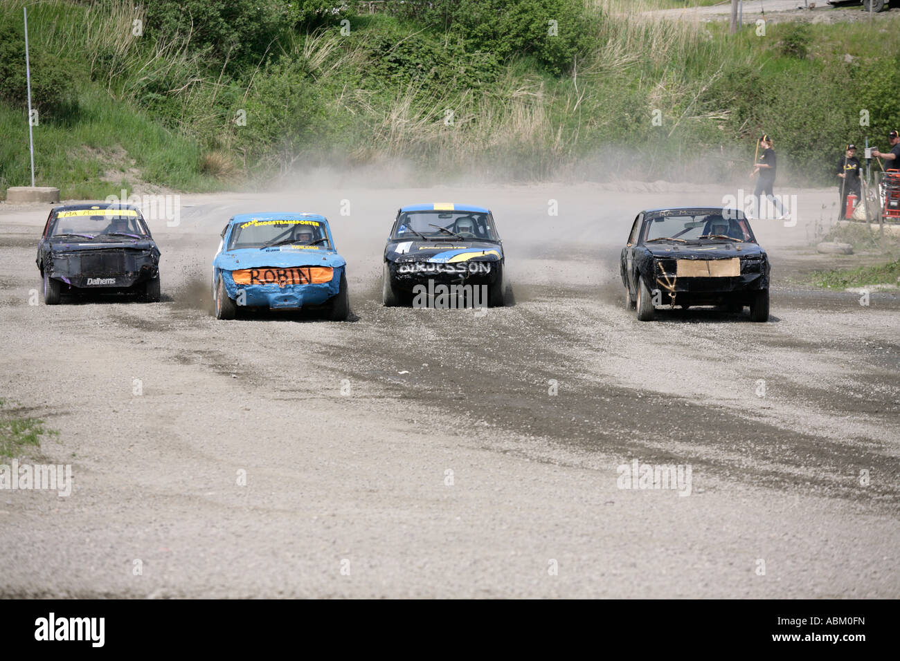 Seconds after flag off drivers fight to take the lead in Folkrace banger racing at Torslanda Racecourse Gothenburg Sweden Stock Photo