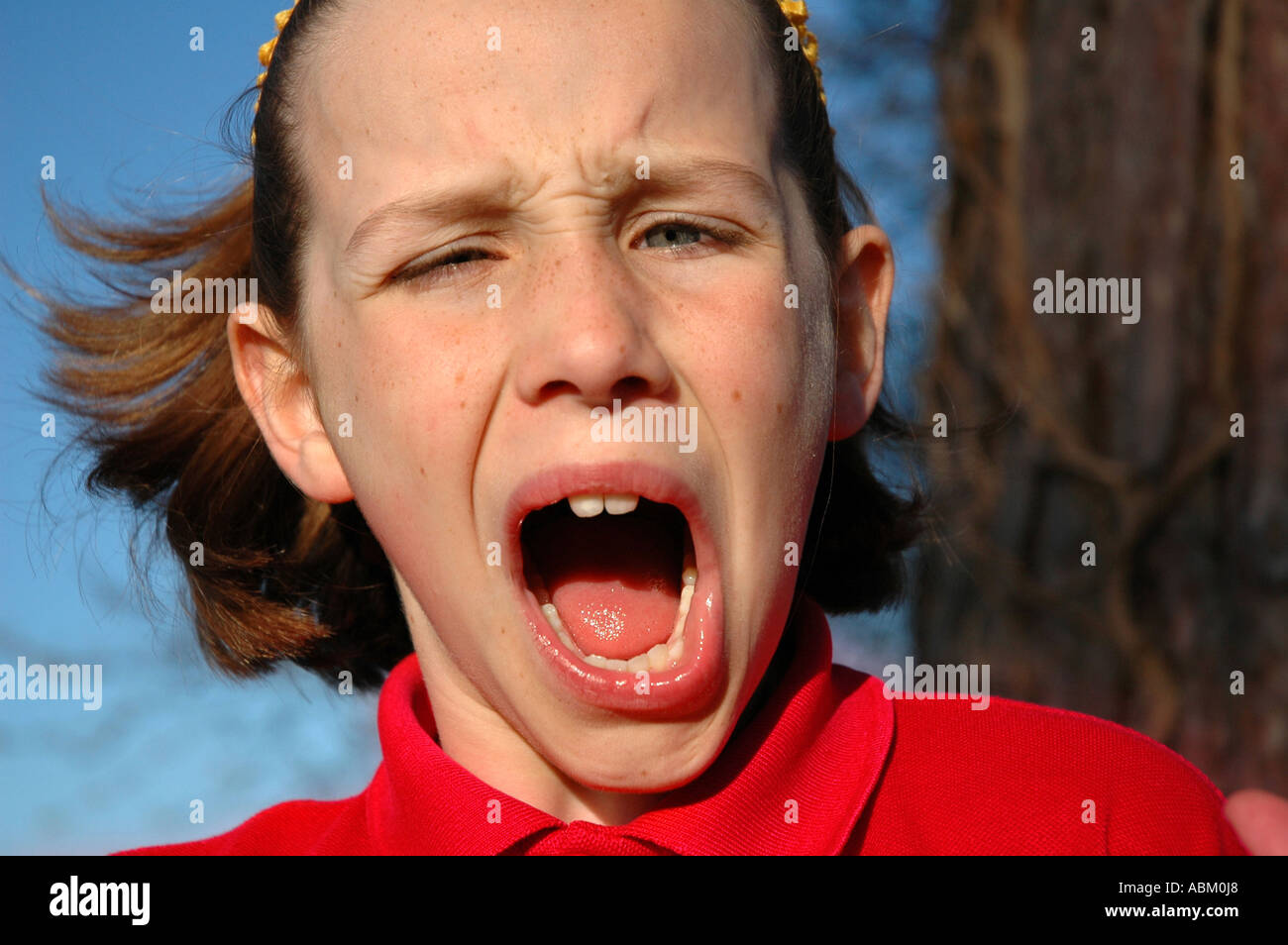 portrait of child looking disgusted and pulling a funny face Stock Photo