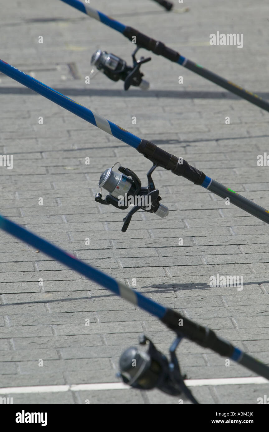 Three fishing rods with reels next to the River Nervion, Calle Ripa, Bilbao, Pais Vasco (Basque Country), northern Spain, Europe Stock Photo