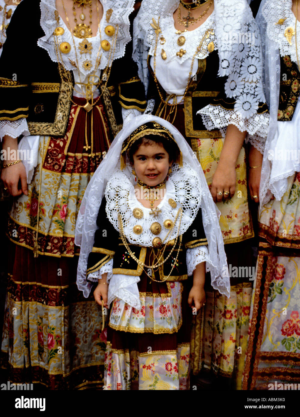 Elaborate traditional costumes are worn by local people at Cavalcata Sarda annual  festival parade in Sassari,Sardinia,Italy Stock Photo