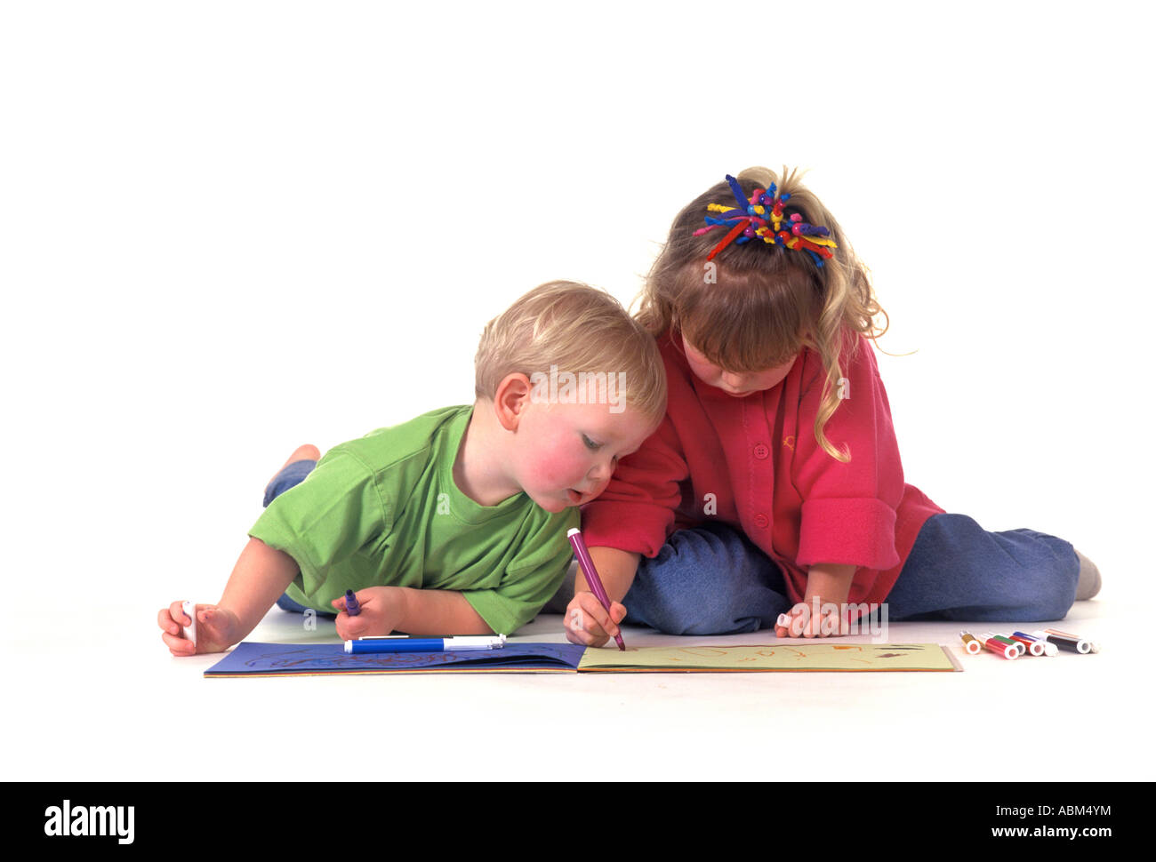 Two children are making a drawing Stock Photo - Alamy