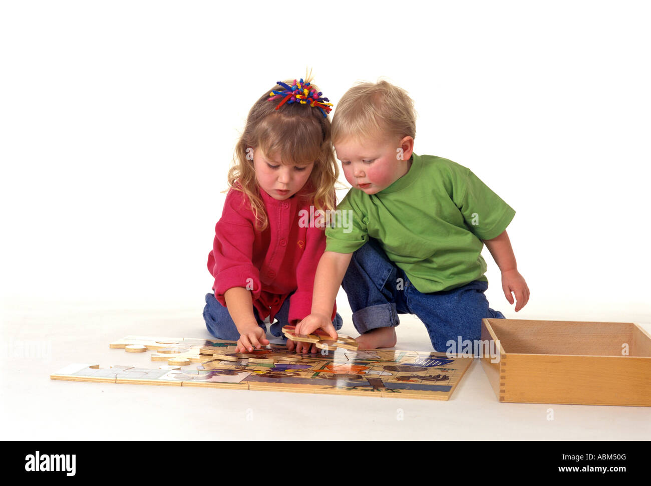 Children making a puzzle hi-res stock photography and images - Alamy