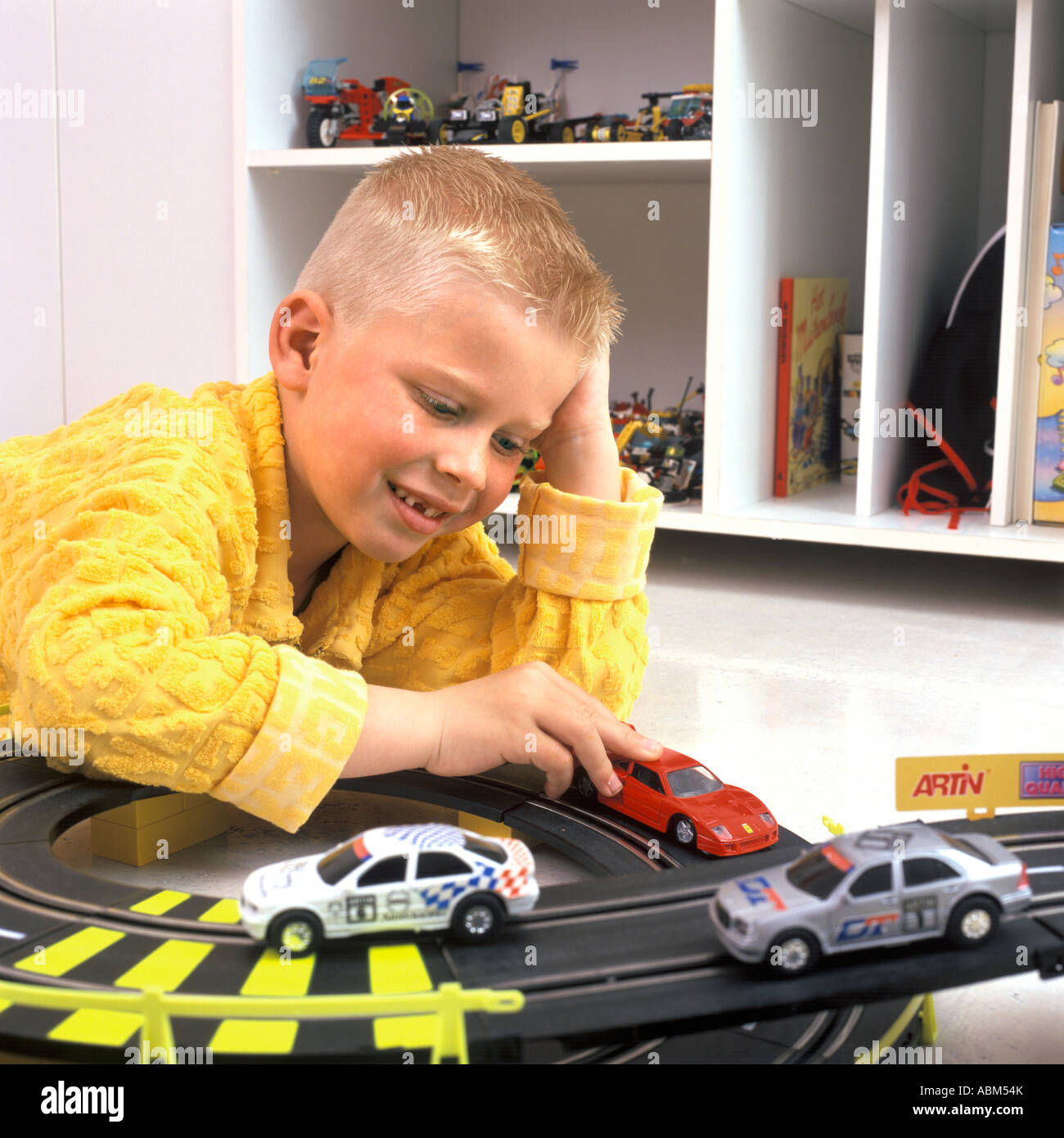 Little boy is playing with toy cars Stock Photo - Alamy