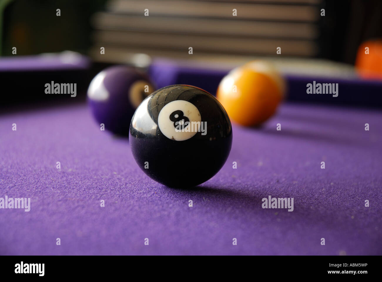Eight ball on pool table Stock Photo