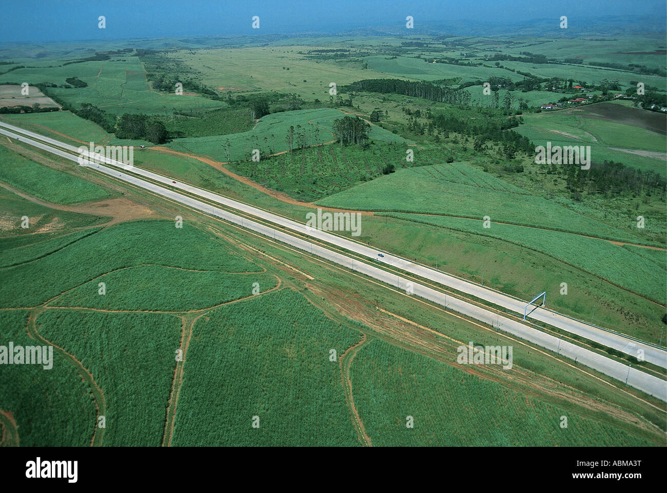 Aerial view of dual carriageway road through Sugar cane plantations Natal Coast South Africa Stock Photo