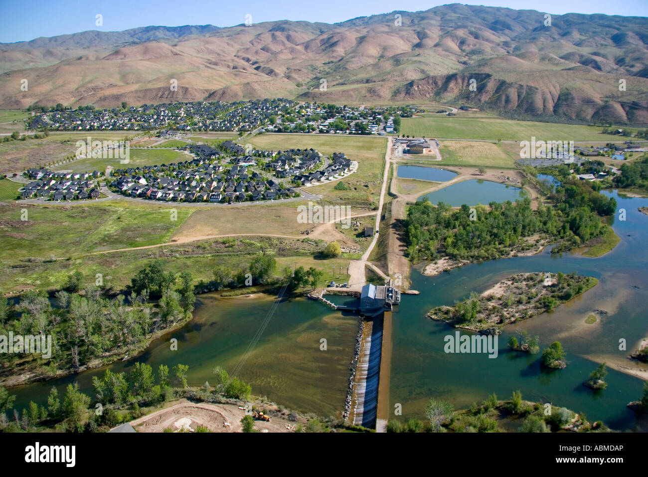 Aerial view of historic Barber Dam on the Boise River and Harris Ranch subdivision in Boise Idaho Stock Photo