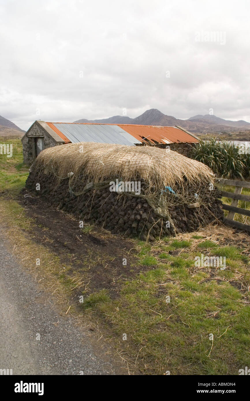 Pile of peat logs with traditional net covering Renvyle peninsula