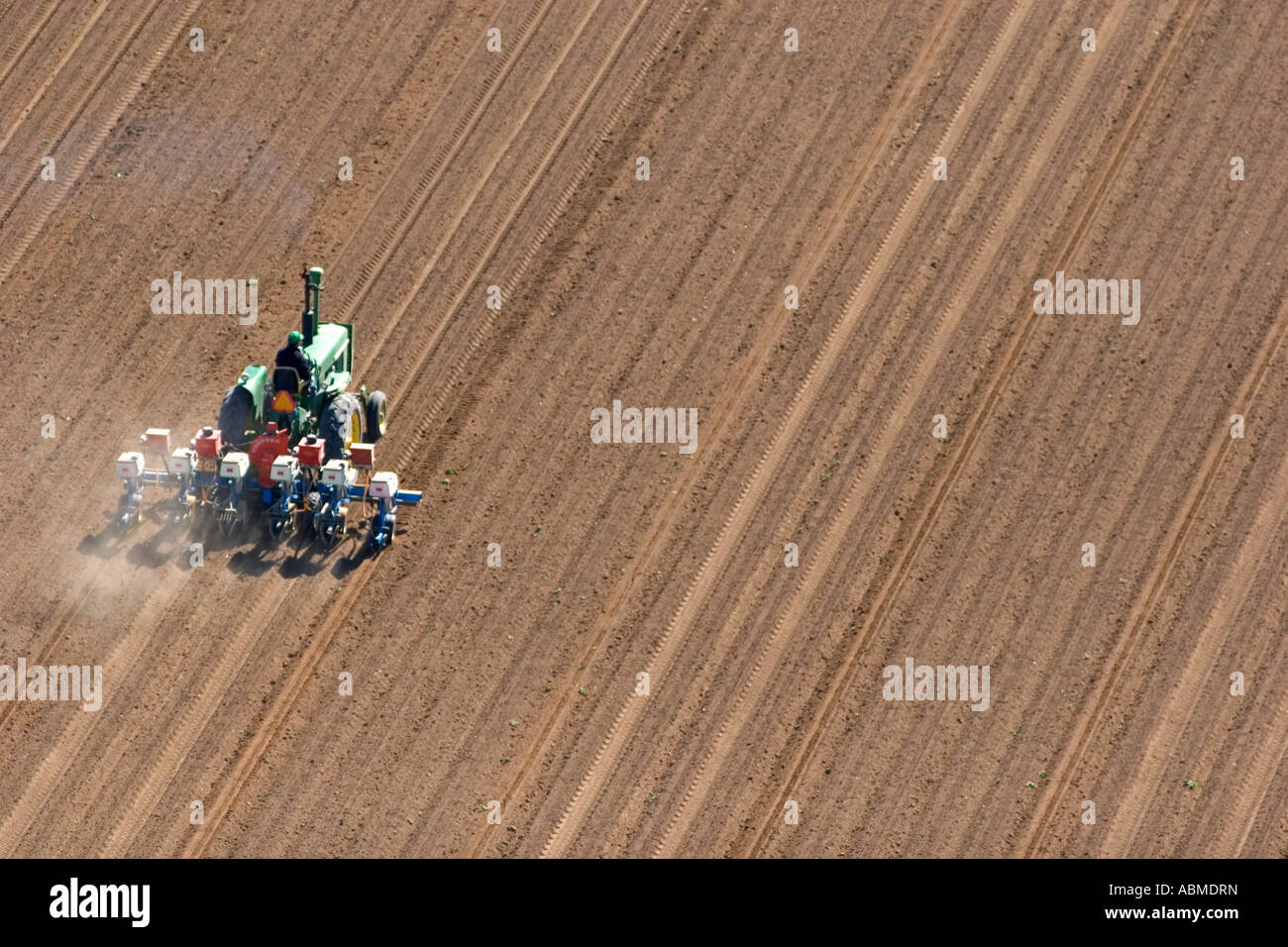Aerial view of a farmer on a tractor planting seed in Canyon County Idaho Stock Photo