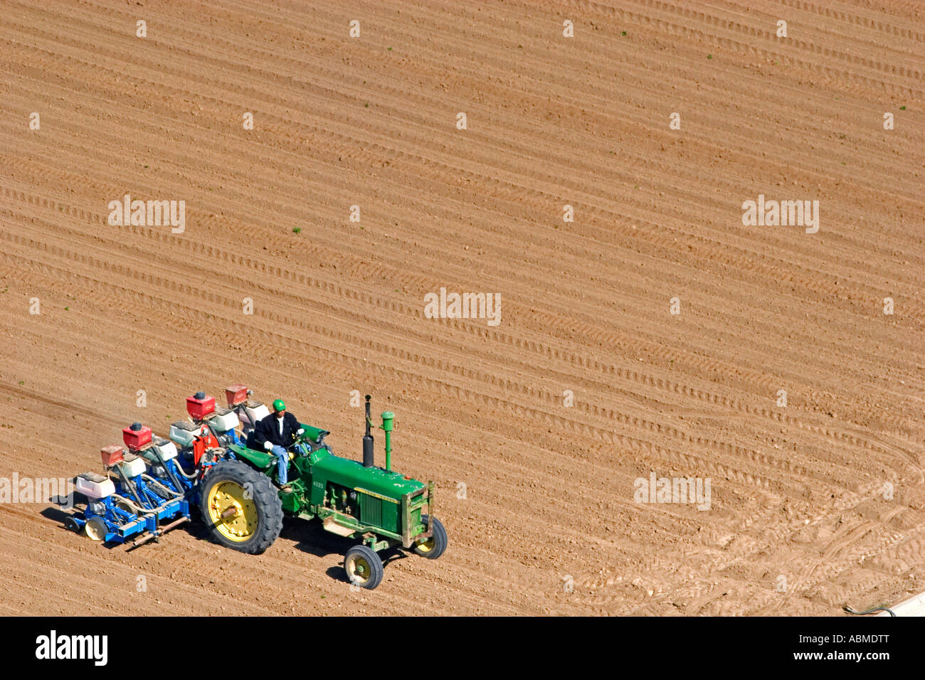 Aerial view of a farmer on a tractor planting seed in Canyon County Idaho Stock Photo