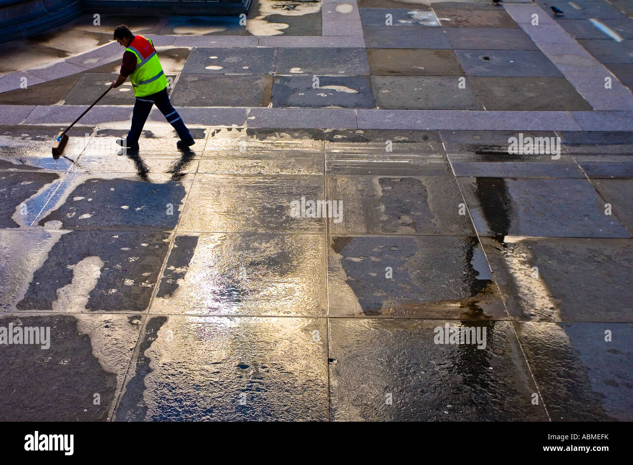Worker cleaning Trafalgar Square Stock Photo Alamy