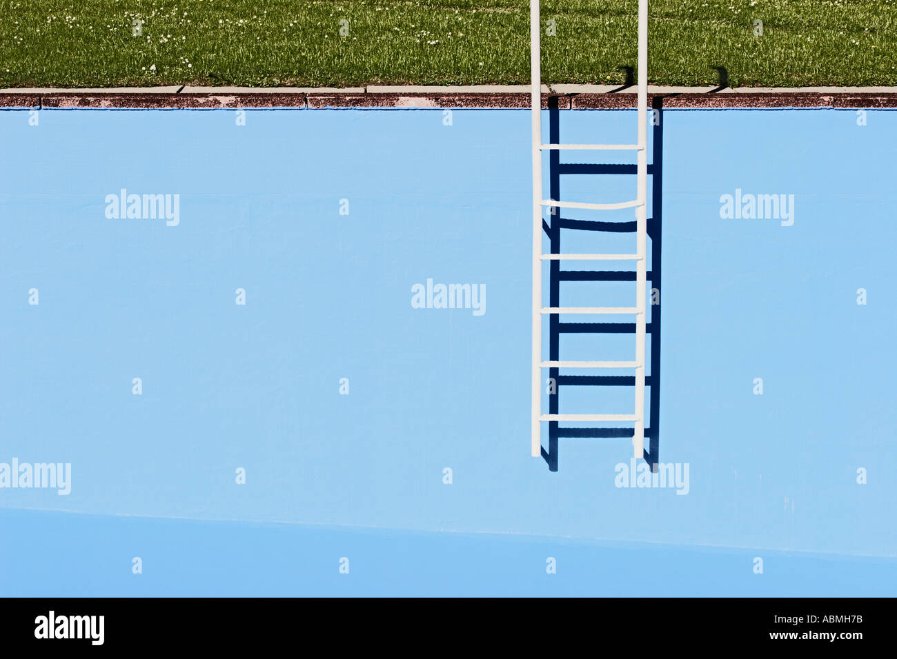 Ladder At Wall Of Empty Swimming Pool Stock Photo