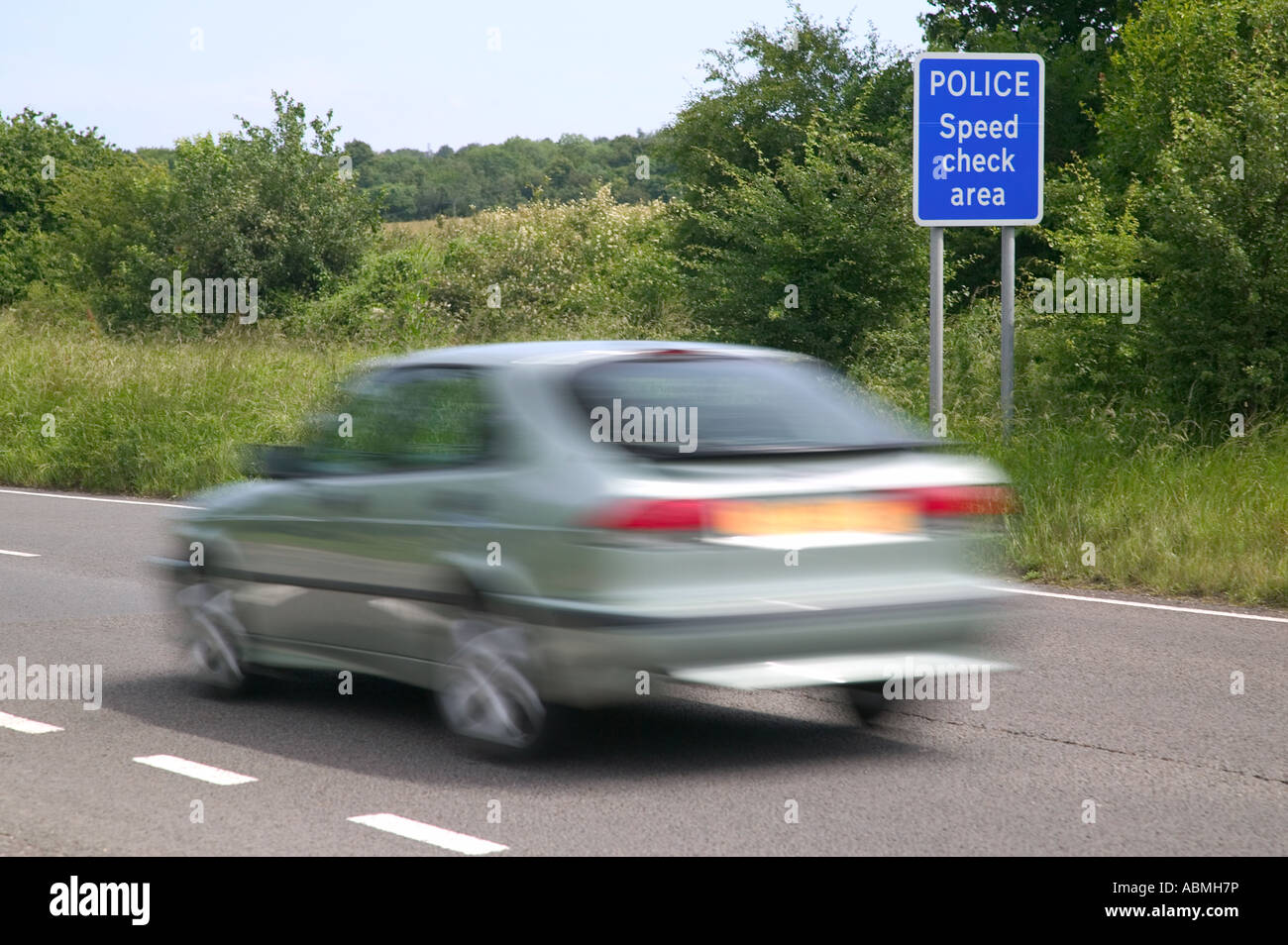 Car driving through a Police speed check area Stock Photo