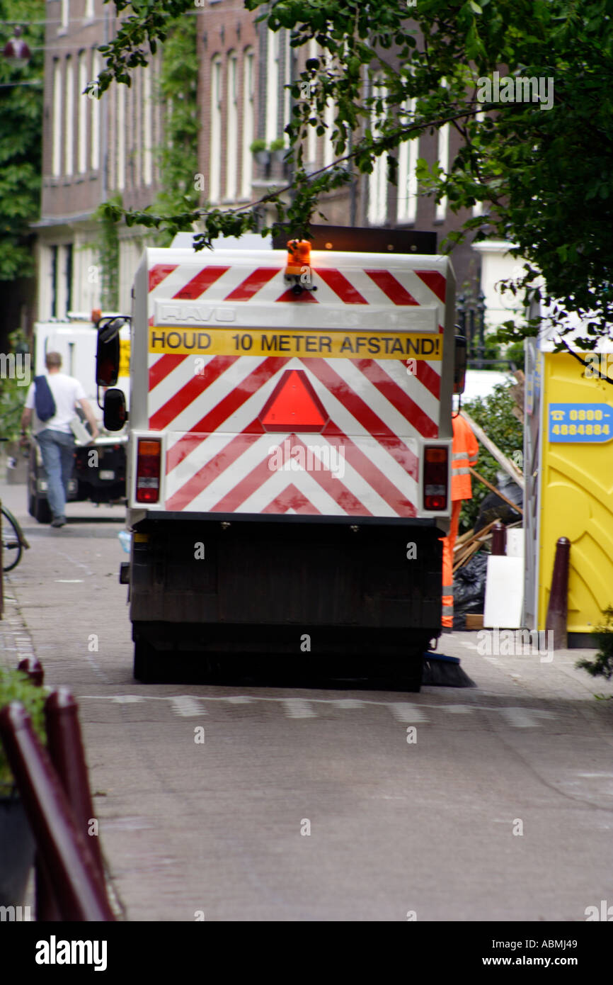 Early morning street cleaners on the Herengracht Amsterdam Holland