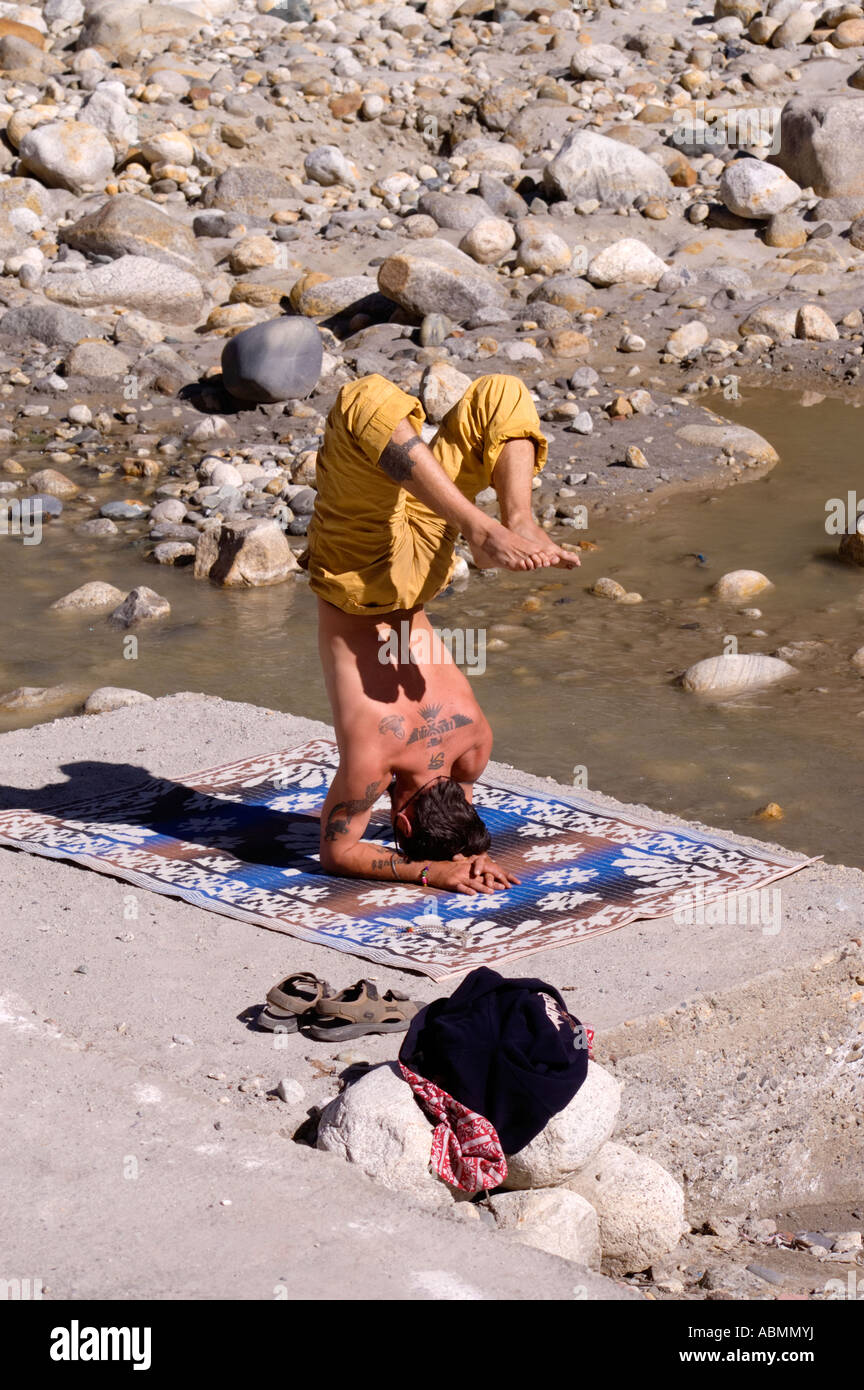 A man practicing yoga in small village Gangotri close to the source of Ganges river Stock Photo