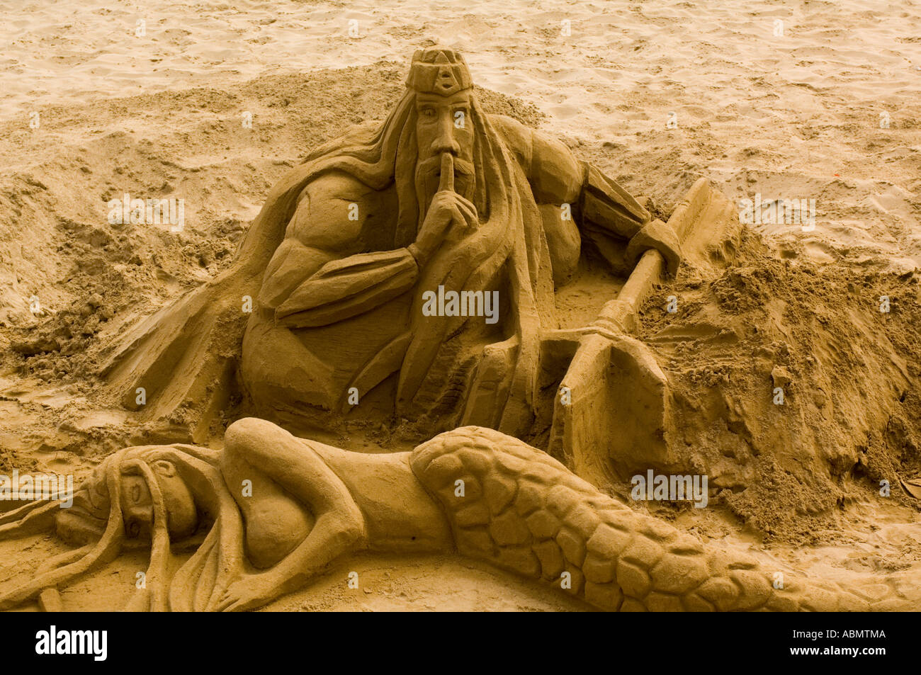 Sand sculpture of Neptune and mermaid on Sitges Beach, Spain Stock ...
