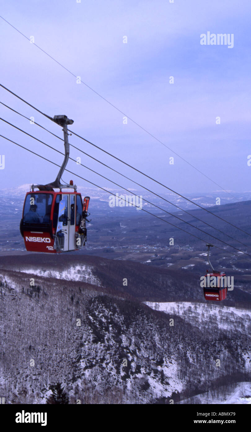 Cable Cars take skiers and snowboards up the mountain at Niseko resort in Hokkaido Japan Stock Photo