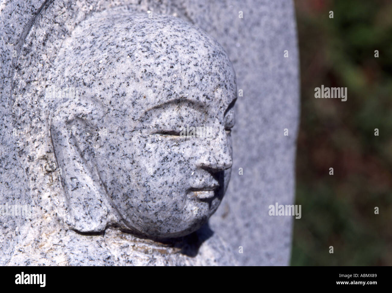Stone carving on Buddhist grave Stock Photo