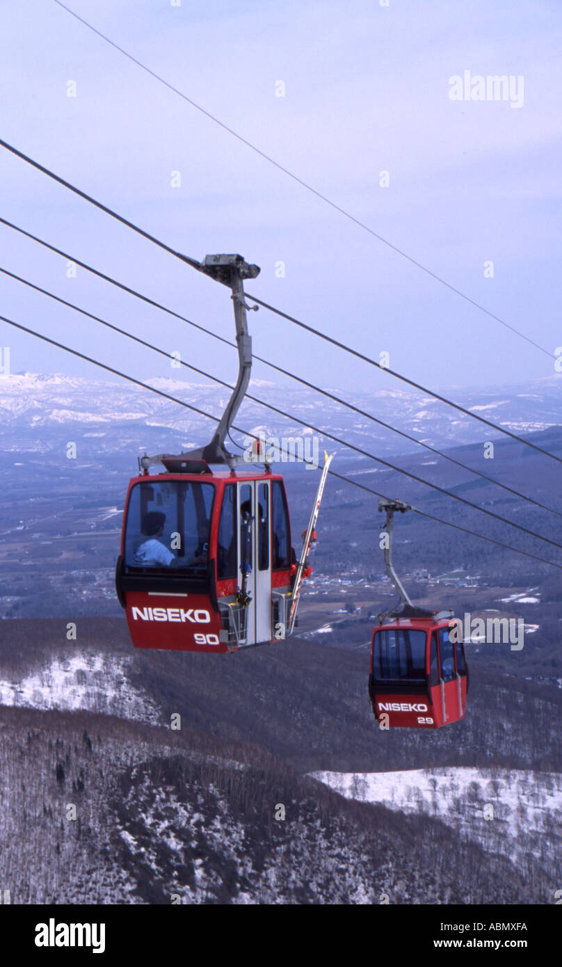 Cable Cars take skiers and snowboards up the mountain at Niseko resort in Hokkaido Japan Stock Photo