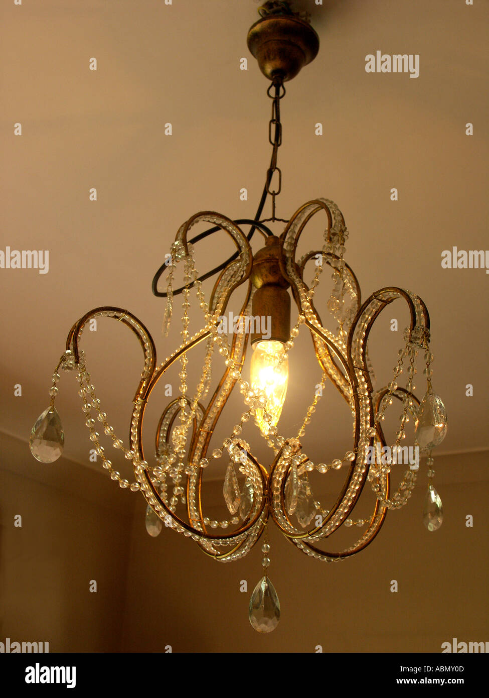 a chandelier switched on in a luxurious dinning room in an english country estate, worcestershire england Stock Photo
