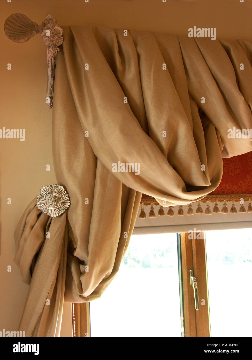 close up aspect of curtains framing a window in a luxurious dinning room in an english country estate, worcestershire england Stock Photo