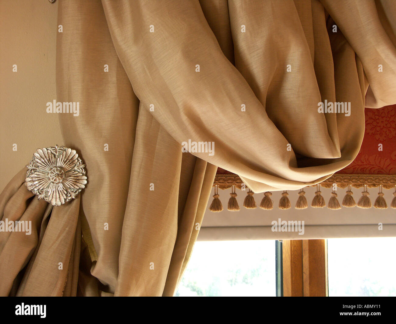 close up aspect of curtains framing a window in a luxurious dinning room in an english country estate, worcestershire england Stock Photo