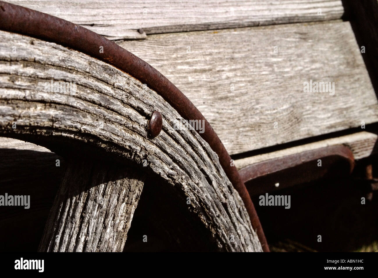 old wooden wheel's iron rim in the Sukanen Pioneer Village Stock Photo