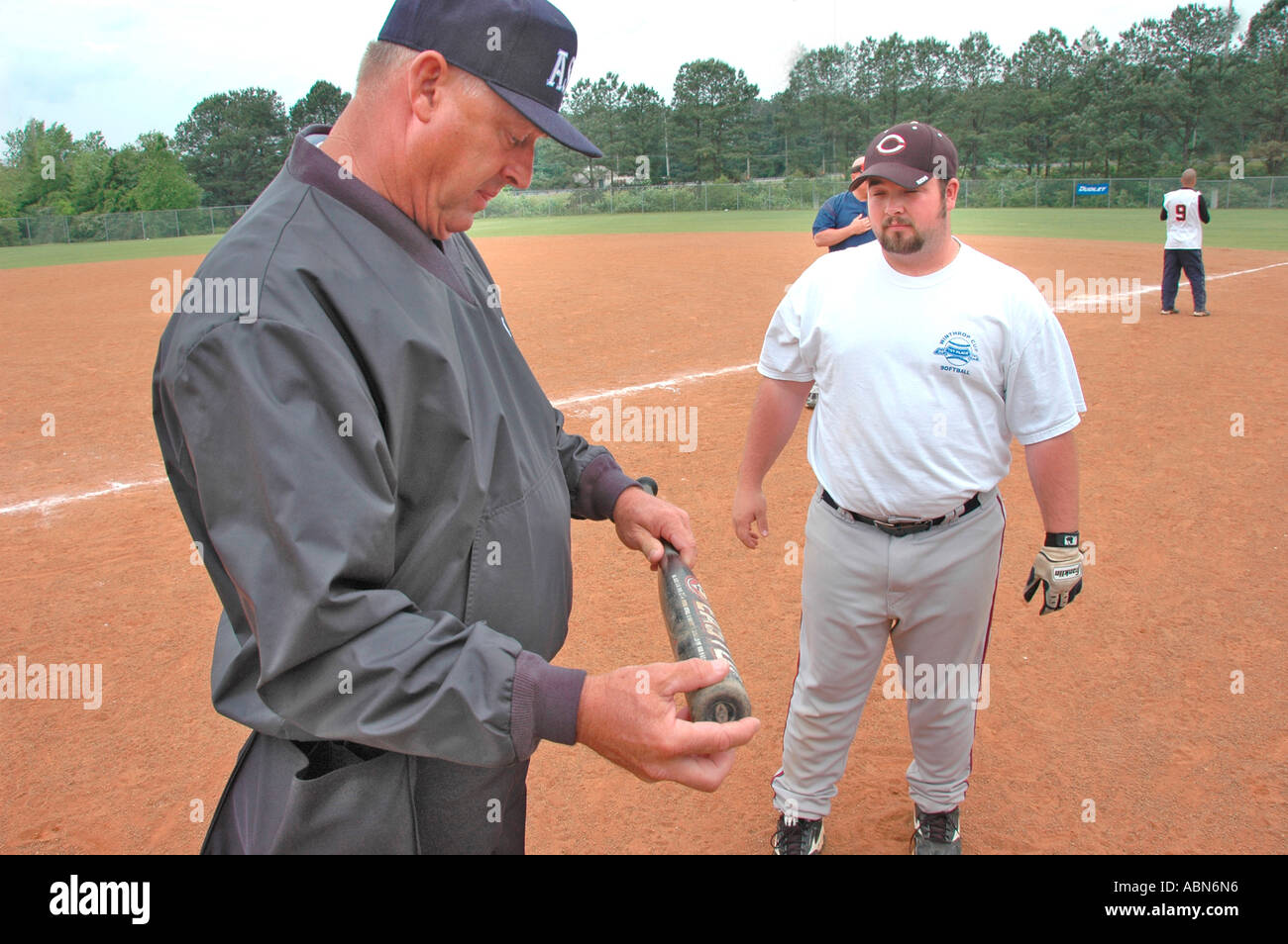 New softball umpires for ASA organization in USA and America during games  and in pregame checking bats and lineups and rules and such for team games  Stock Photo - Alamy