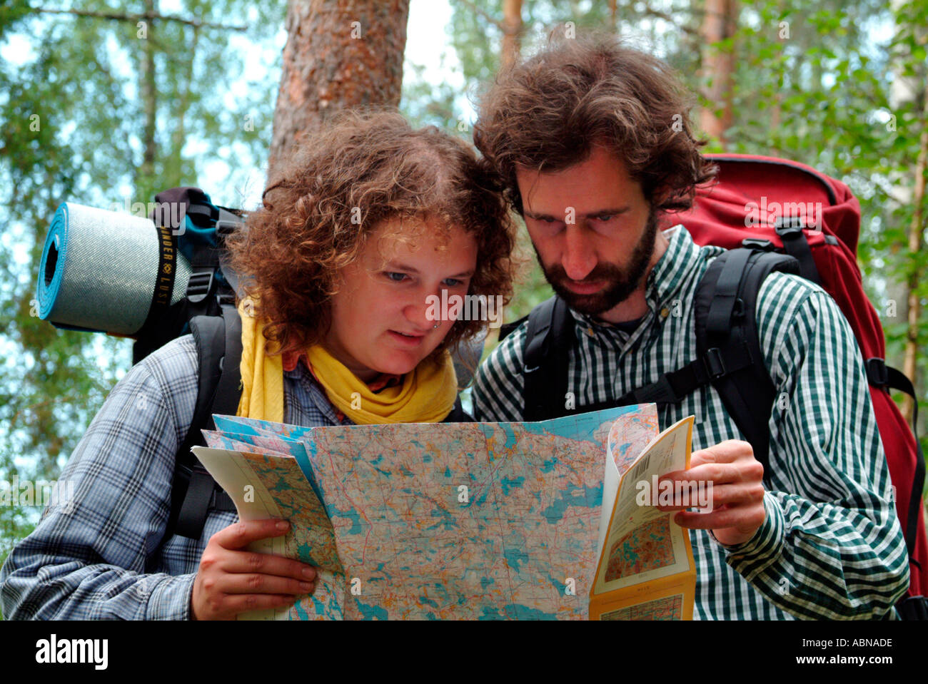 young couple hiking and studying a map together MR Stock Photo - Alamy