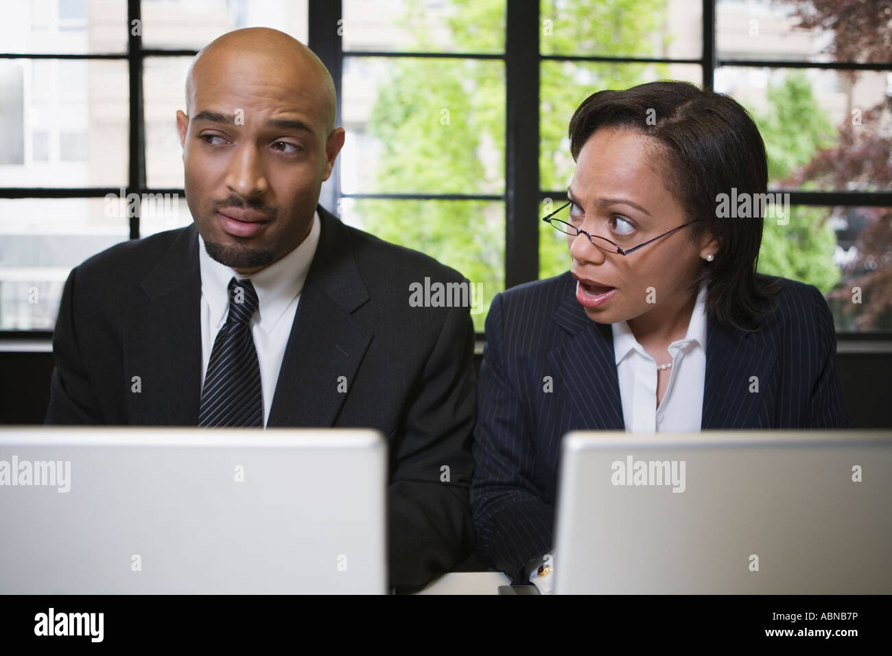 Businesspeople working at separate laptops Stock Photo Alamy