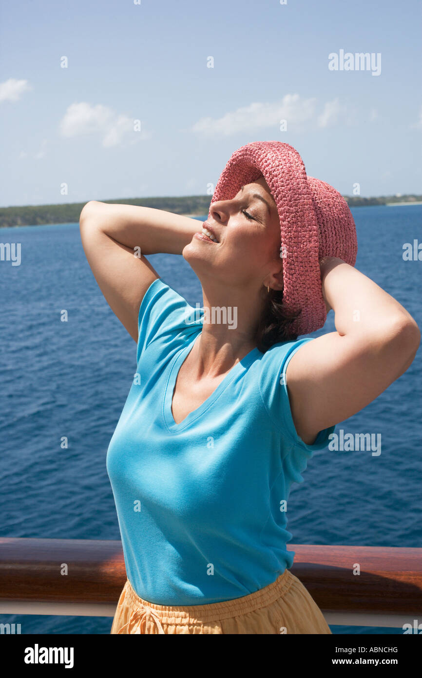 Woman sunbathing on deck of ship Stock Photo - Alamy